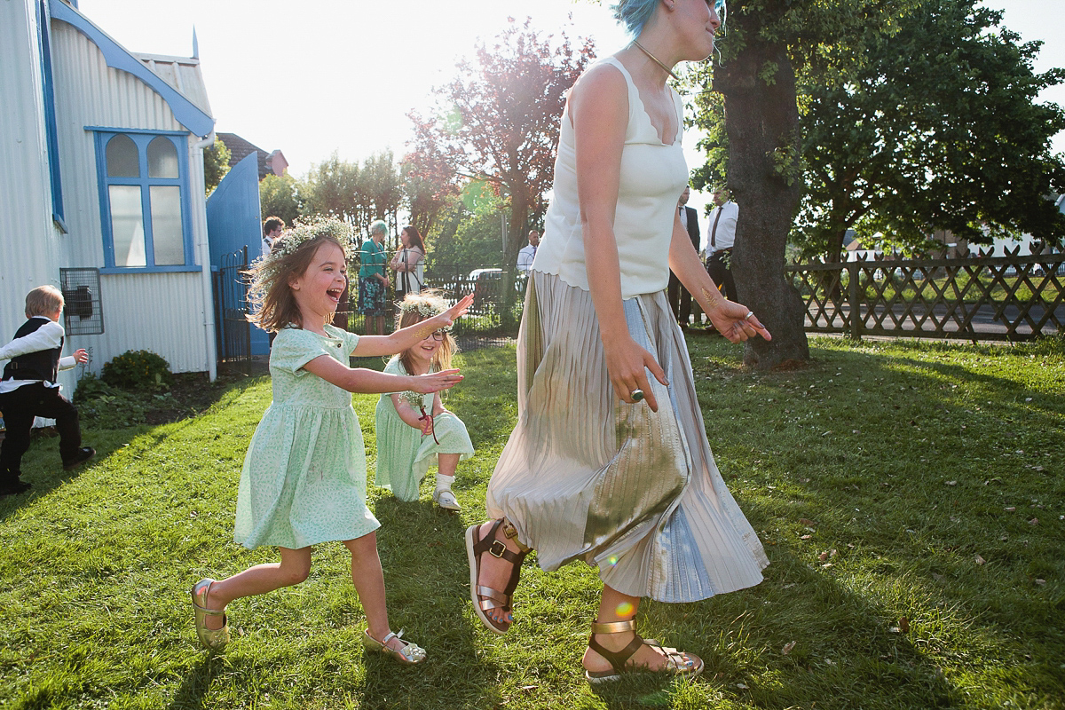 Sophie wore a Ghost dress for her elegant Spring wedding. Her bridesmaids wore mint green. Photography by Matilda Delves.