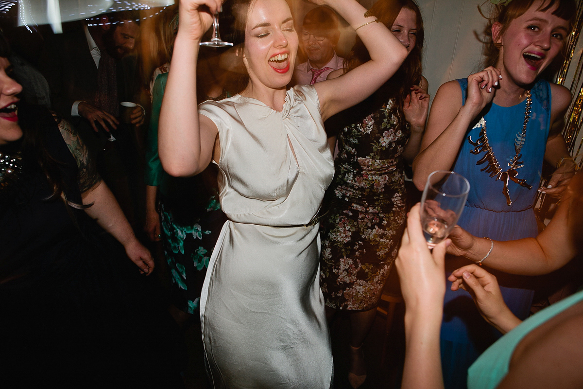 Sophie wore a Ghost dress for her elegant Spring wedding. Her bridesmaids wore mint green. Photography by Matilda Delves.