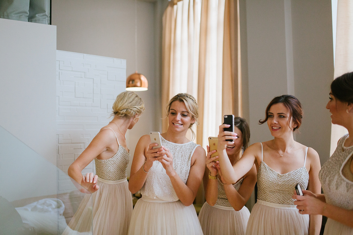 Emma wore Rime Aradaky separates and a polka dot veil by Luna Bea, for her fun, relaxed and cool East London wedding at MC Motors in Dalston. Photography by Emma & Pete.