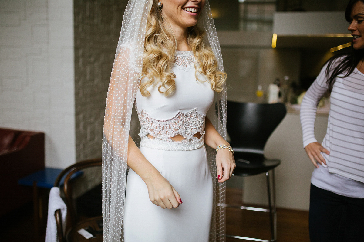 Emma wore Rime Aradaky separates and a polka dot veil by Luna Bea, for her fun, relaxed and cool East London wedding at MC Motors in Dalston. Photography by Emma & Pete.