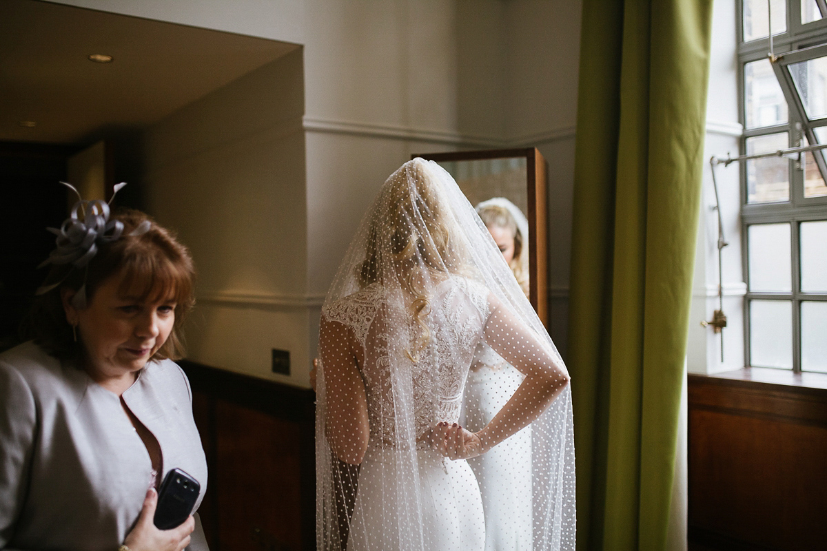 Emma wore Rime Aradaky separates and a polka dot veil by Luna Bea, for her fun, relaxed and cool East London wedding at MC Motors in Dalston. Photography by Emma & Pete.