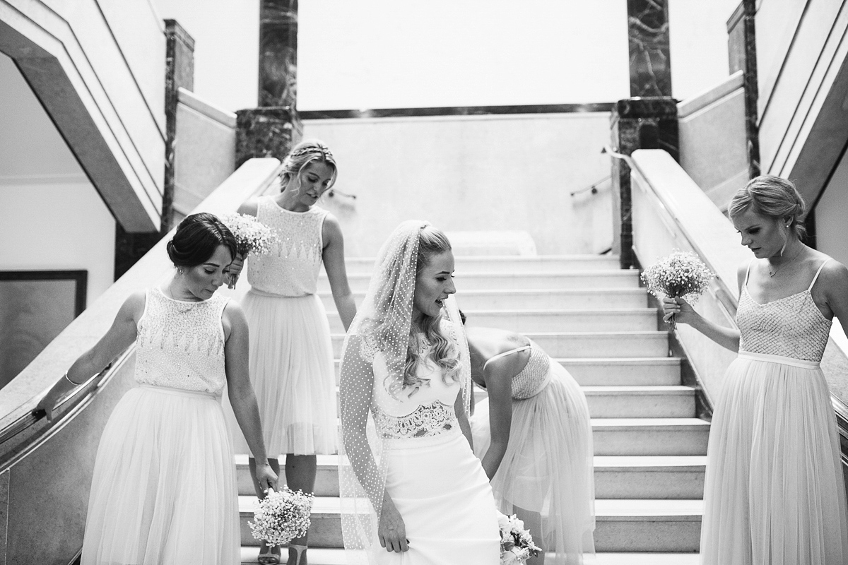 Emma wore Rime Aradaky separates and a polka dot veil by Luna Bea, for her fun, relaxed and cool East London wedding at MC Motors in Dalston. Photography by Emma & Pete.