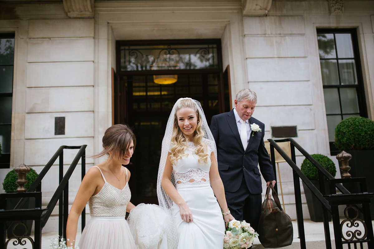 Emma wore Rime Aradaky separates and a polka dot veil by Luna Bea, for her fun, relaxed and cool East London wedding at MC Motors in Dalston. Photography by Emma & Pete.