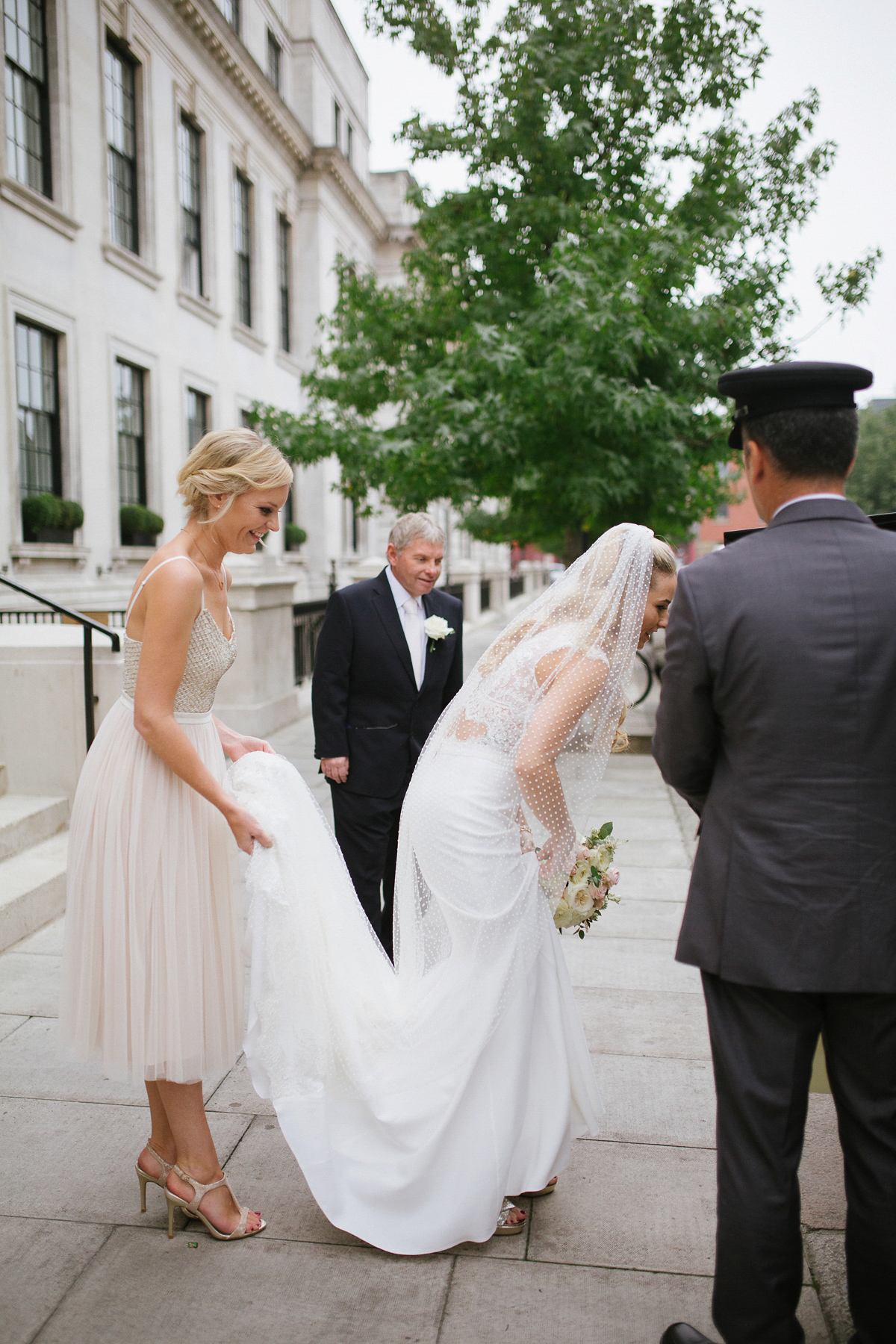 Emma wore Rime Aradaky separates and a polka dot veil by Luna Bea, for her fun, relaxed and cool East London wedding at MC Motors in Dalston. Photography by Emma & Pete.