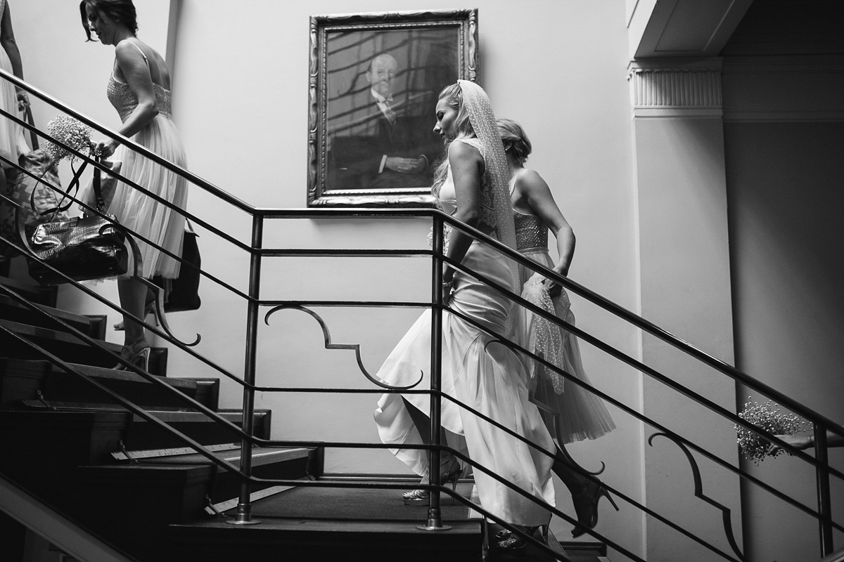 Emma wore Rime Aradaky separates and a polka dot veil by Luna Bea, for her fun, relaxed and cool East London wedding at MC Motors in Dalston. Photography by Emma & Pete.