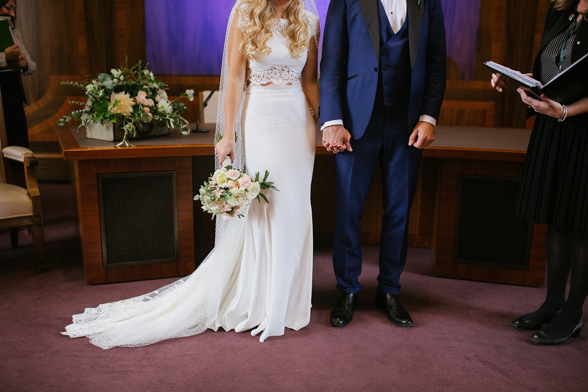 Emma wore Rime Aradaky separates and a polka dot veil by Luna Bea, for her fun, relaxed and cool East London wedding at MC Motors in Dalston. Photography by Emma & Pete.