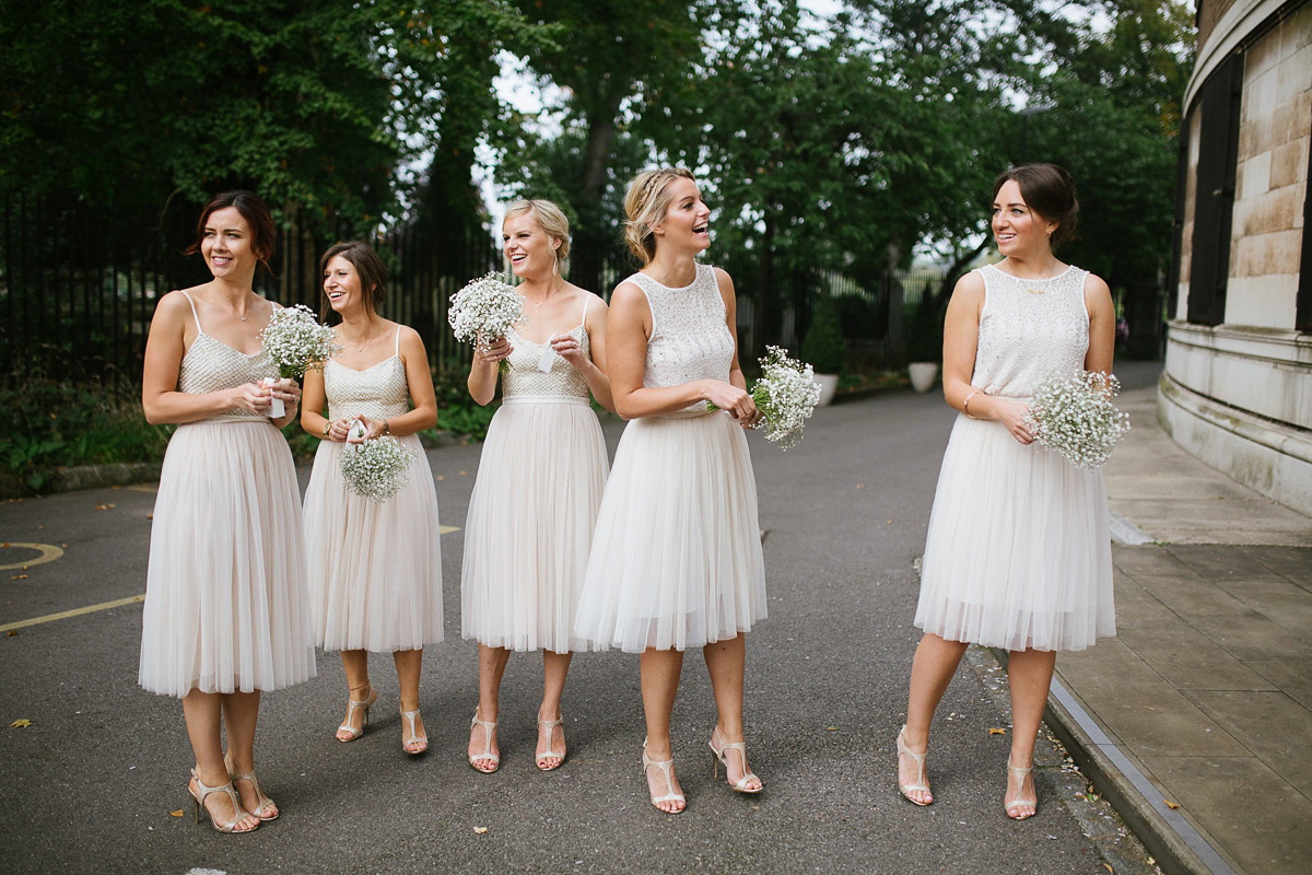 Emma wore Rime Aradaky separates and a polka dot veil by Luna Bea, for her fun, relaxed and cool East London wedding at MC Motors in Dalston. Photography by Emma & Pete.