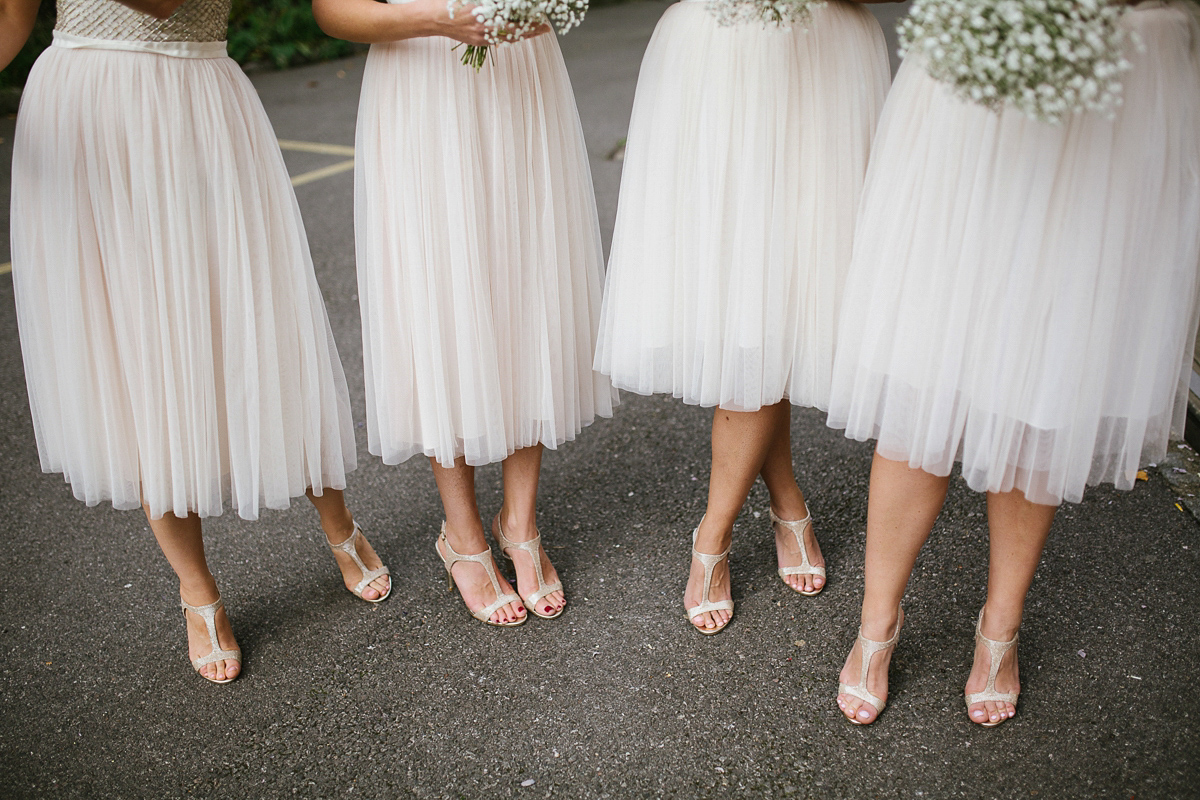 Emma wore Rime Aradaky separates and a polka dot veil by Luna Bea, for her fun, relaxed and cool East London wedding at MC Motors in Dalston. Photography by Emma & Pete.