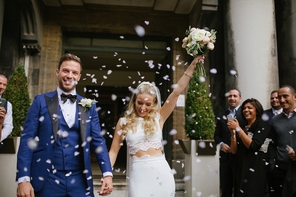 Emma wore Rime Aradaky separates and a polka dot veil by Luna Bea, for her fun, relaxed and cool East London wedding at MC Motors in Dalston. Photography by Emma & Pete.