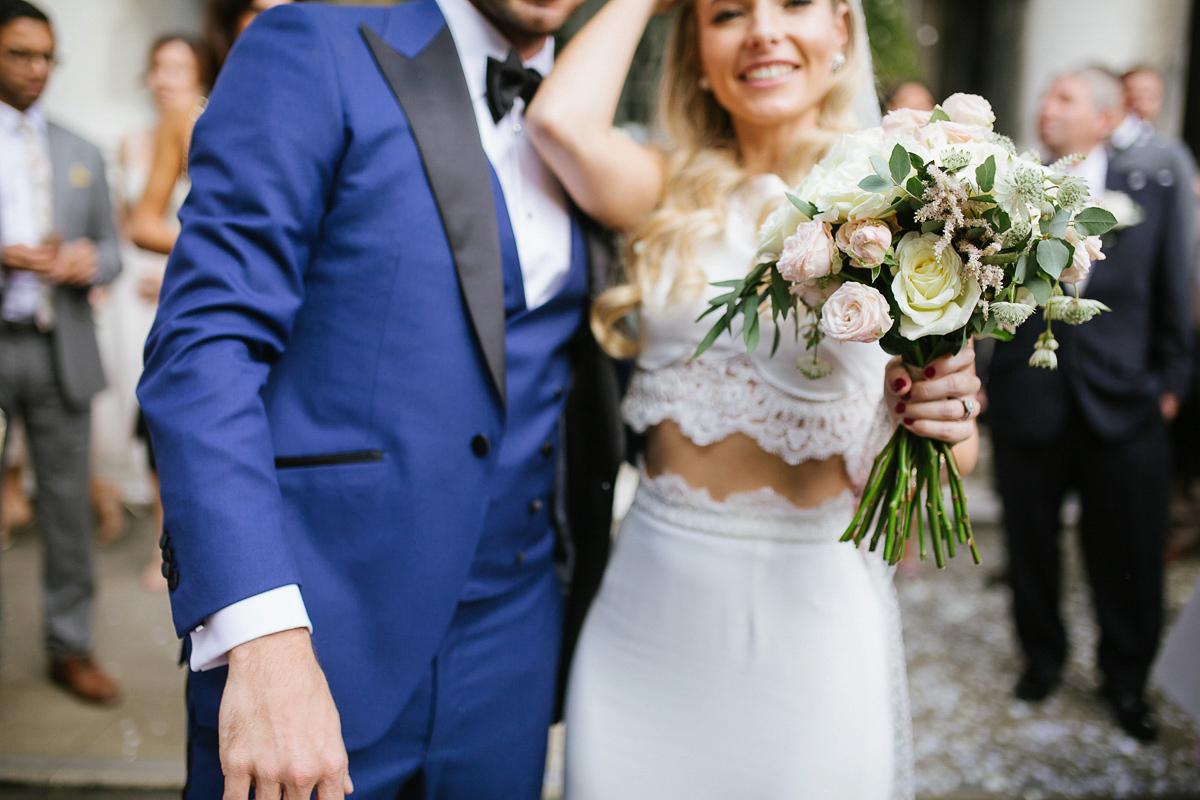 Emma wore Rime Aradaky separates and a polka dot veil by Luna Bea, for her fun, relaxed and cool East London wedding at MC Motors in Dalston. Photography by Emma & Pete.