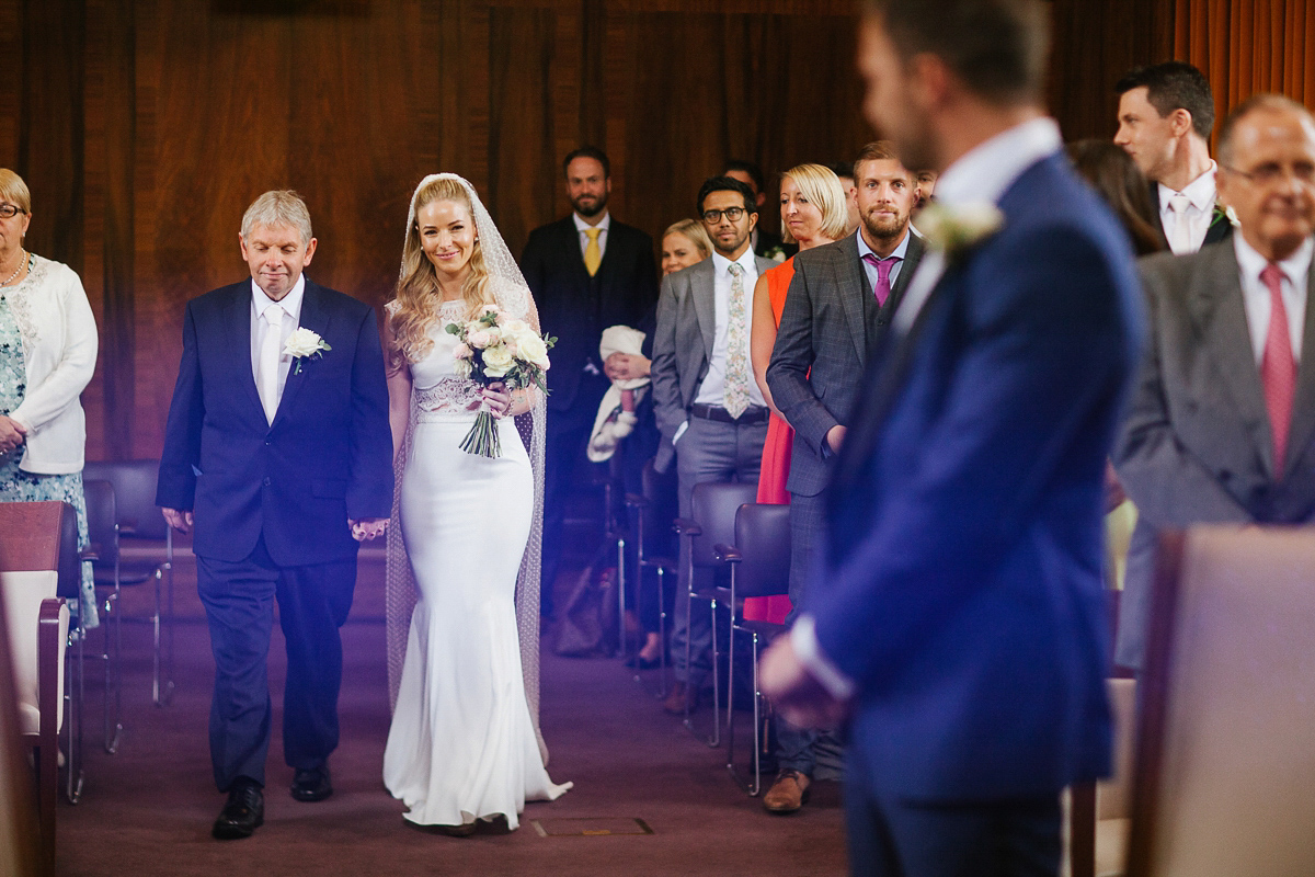 Emma wore Rime Aradaky separates and a polka dot veil by Luna Bea, for her fun, relaxed and cool East London wedding at MC Motors in Dalston. Photography by Emma & Pete.