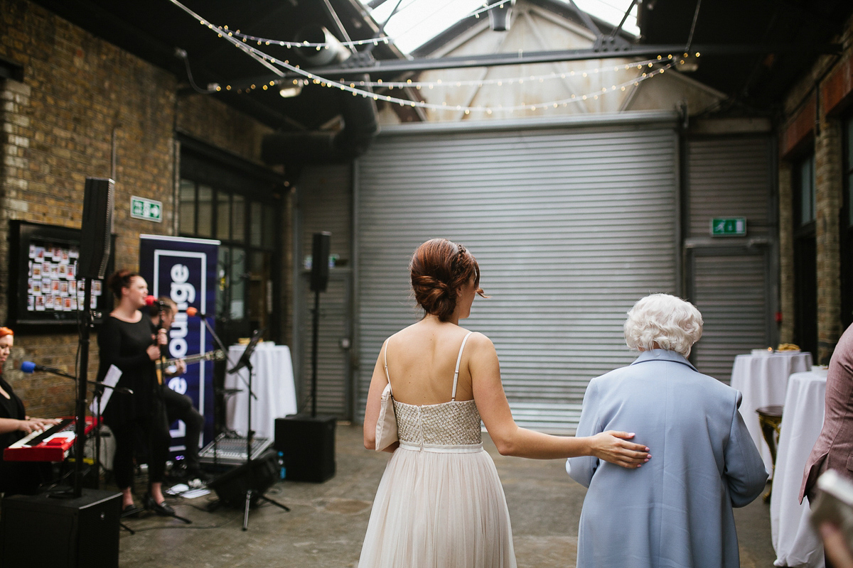 Emma wore Rime Aradaky separates and a polka dot veil by Luna Bea, for her fun, relaxed and cool East London wedding at MC Motors in Dalston. Photography by Emma & Pete.