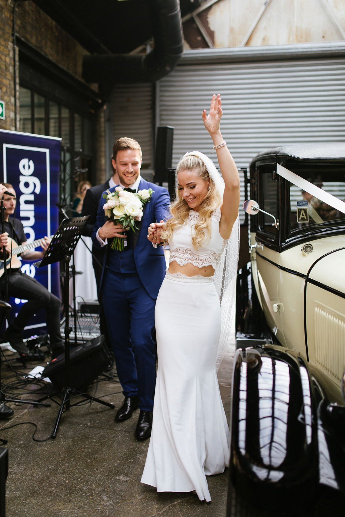 Emma wore Rime Aradaky separates and a polka dot veil by Luna Bea, for her fun, relaxed and cool East London wedding at MC Motors in Dalston. Photography by Emma & Pete.