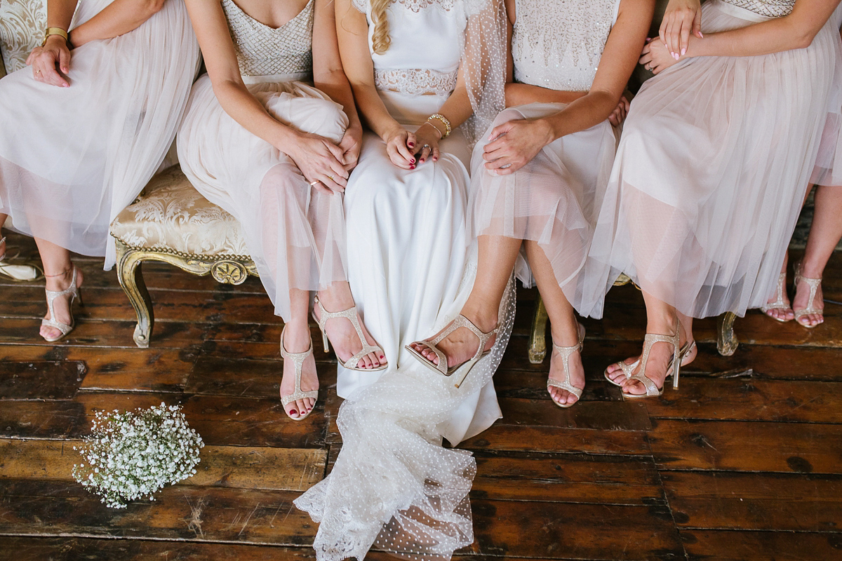 Emma wore Rime Aradaky separates and a polka dot veil by Luna Bea, for her fun, relaxed and cool East London wedding at MC Motors in Dalston. Photography by Emma & Pete.