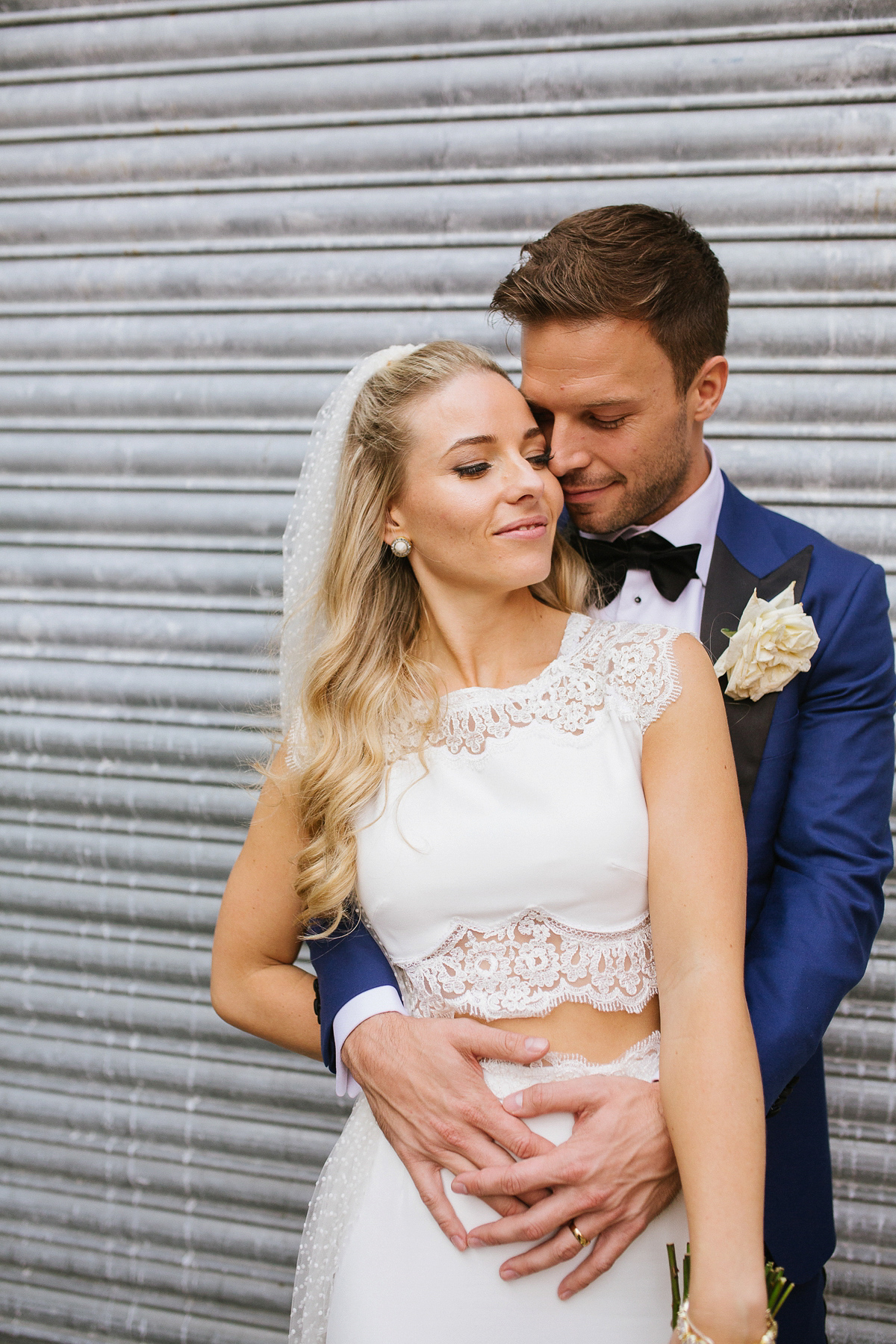 Emma wore Rime Aradaky separates and a polka dot veil by Luna Bea, for her fun, relaxed and cool East London wedding at MC Motors in Dalston. Photography by Emma & Pete.