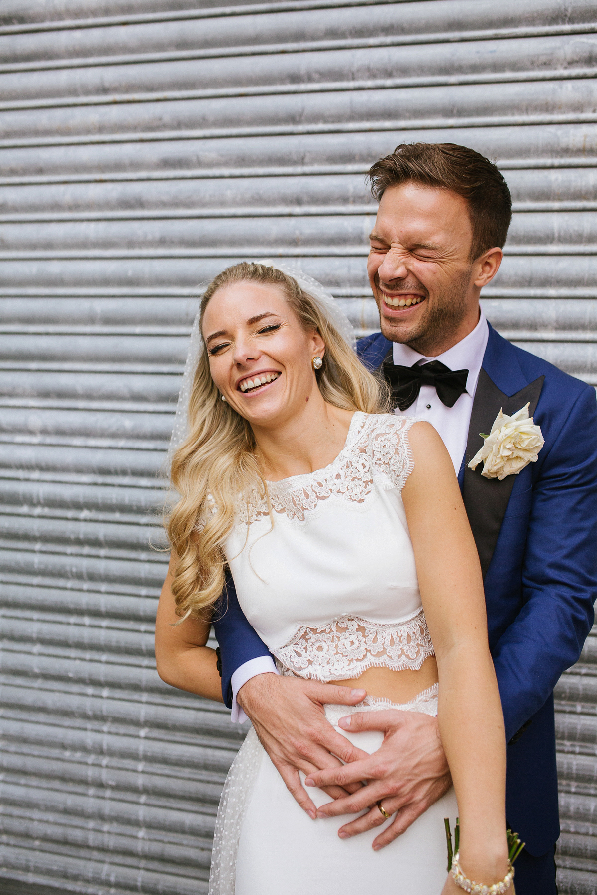 Emma wore Rime Aradaky separates and a polka dot veil by Luna Bea, for her fun, relaxed and cool East London wedding at MC Motors in Dalston. Photography by Emma & Pete.