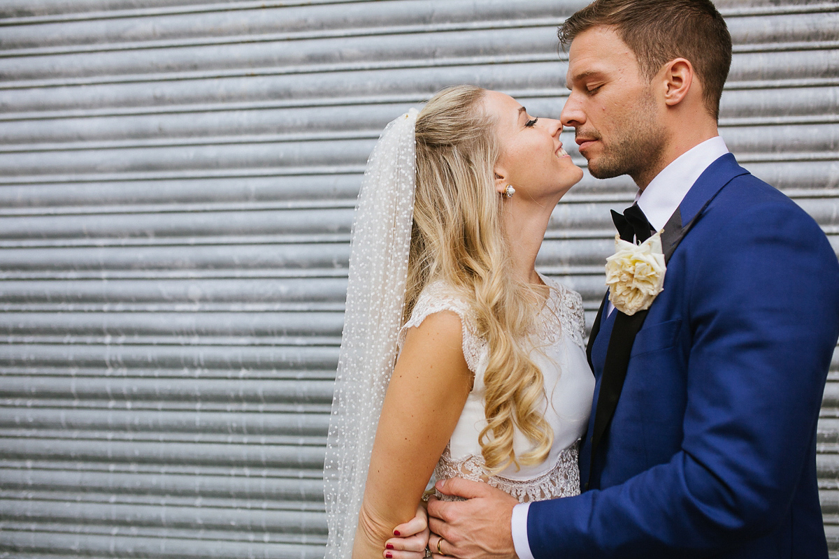 Emma wore Rime Aradaky separates and a polka dot veil by Luna Bea, for her fun, relaxed and cool East London wedding at MC Motors in Dalston. Photography by Emma & Pete.