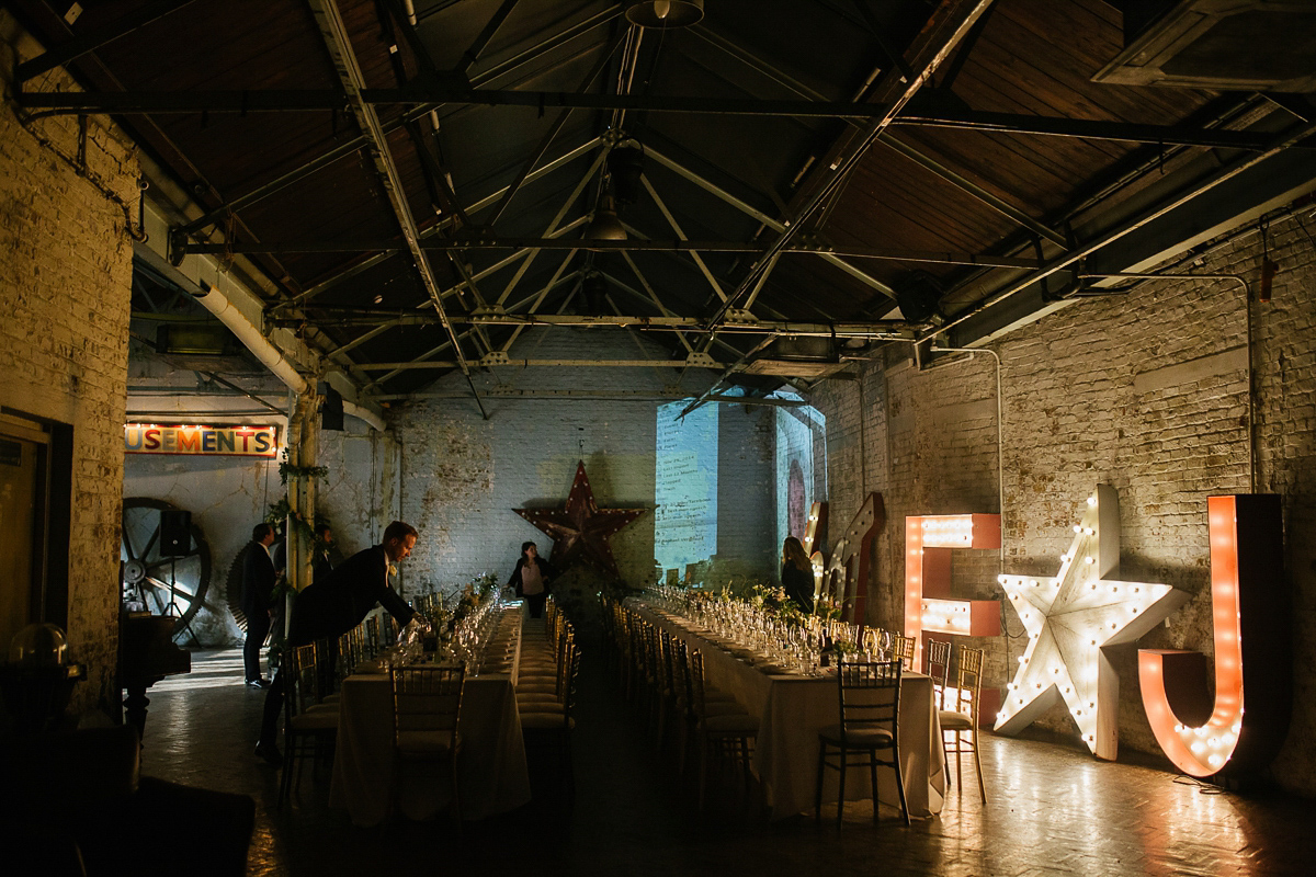 Emma wore Rime Aradaky separates and a polka dot veil by Luna Bea, for her fun, relaxed and cool East London wedding at MC Motors in Dalston. Photography by Emma & Pete.