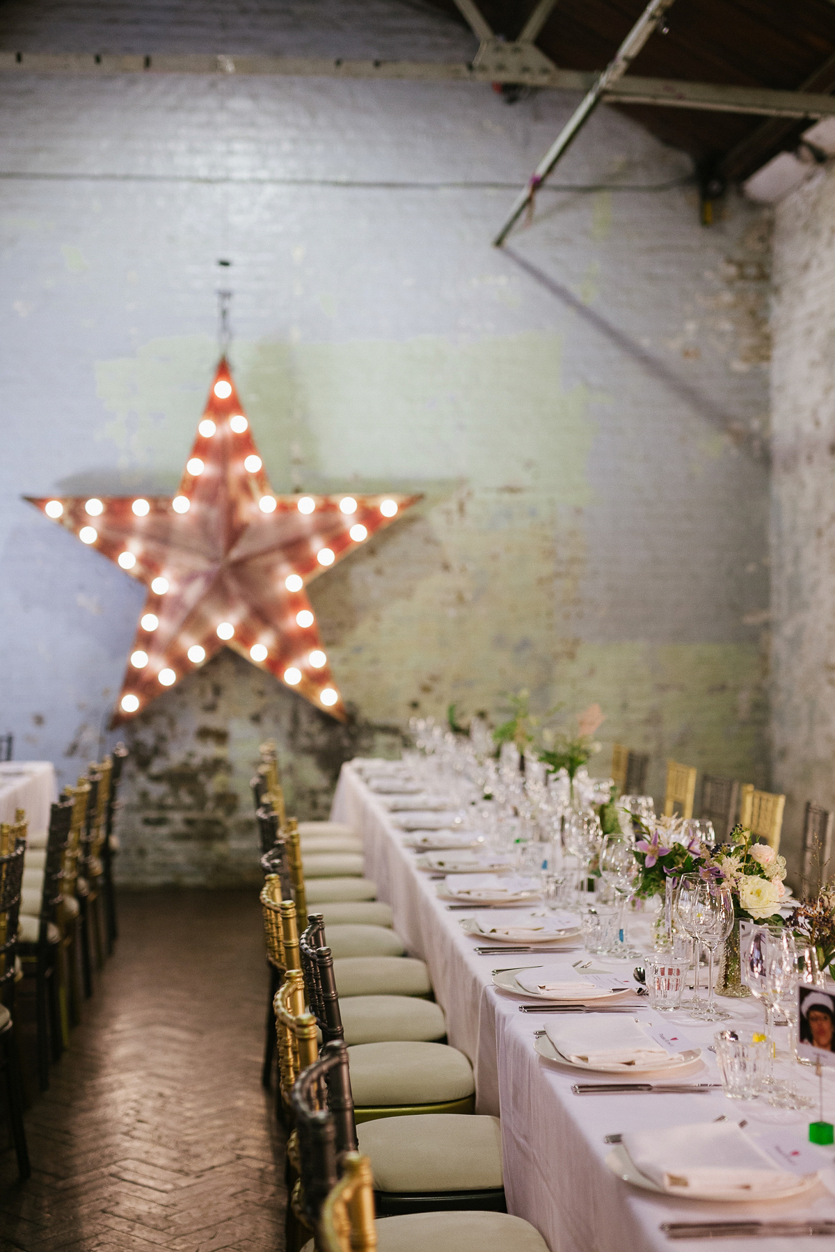 Emma wore Rime Aradaky separates and a polka dot veil by Luna Bea, for her fun, relaxed and cool East London wedding at MC Motors in Dalston. Photography by Emma & Pete.