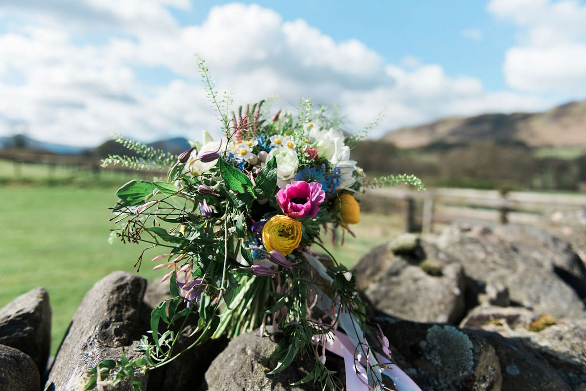 Suzi wears a Yolancris dress and flower crown for her rustic, intimate wedding in the Lake District. Photography by Sarah Folega.