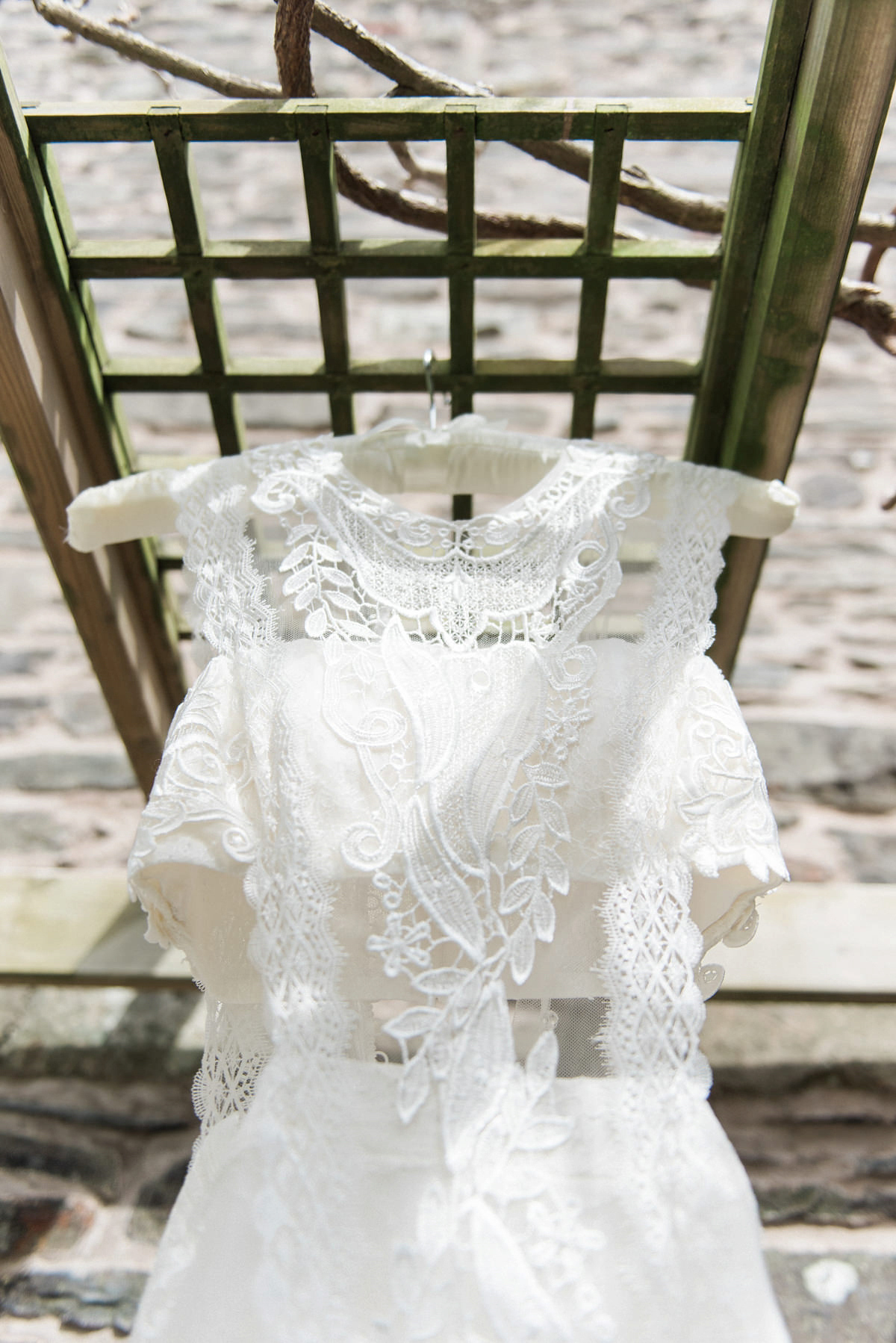 Suzi wears a Yolancris dress and flower crown for her rustic, intimate wedding in the Lake District. Photography by Sarah Folega.