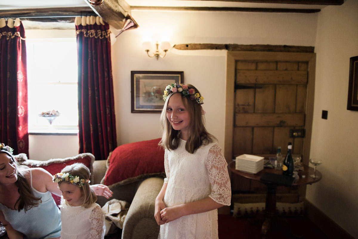 Suzi wears a Yolancris dress and flower crown for her rustic, intimate wedding in the Lake District. Photography by Sarah Folega.