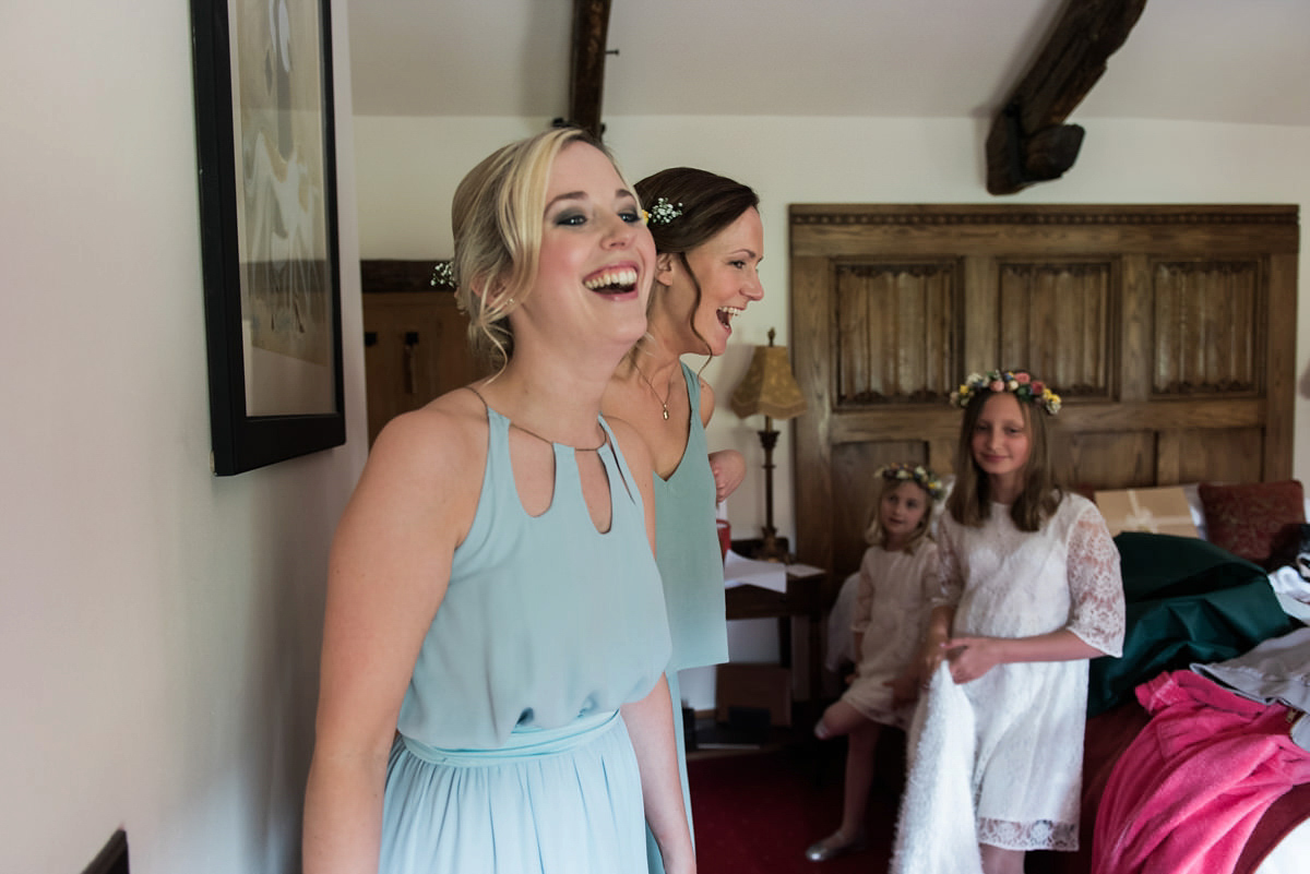 Suzi wears a Yolancris dress and flower crown for her rustic, intimate wedding in the Lake District. Photography by Sarah Folega.