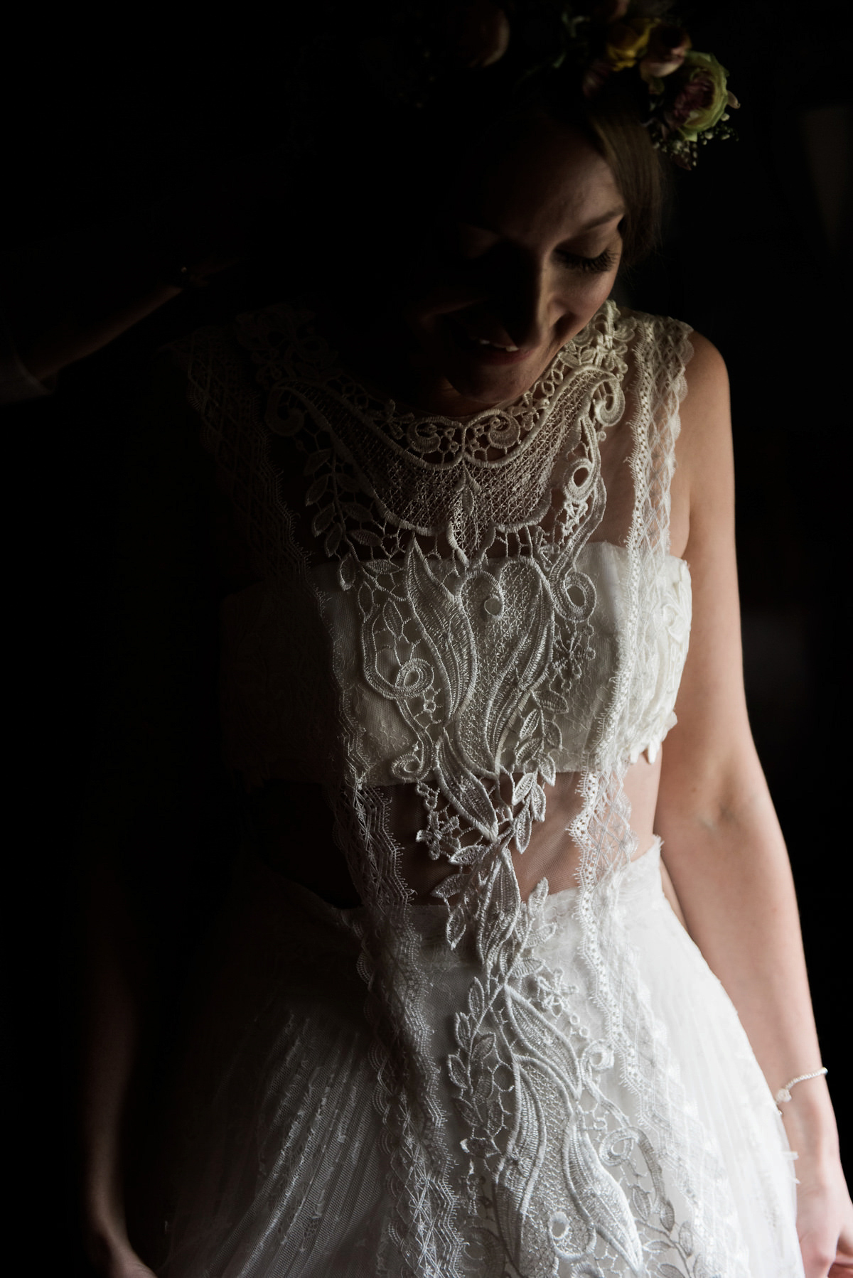 Suzi wears a Yolancris dress and flower crown for her rustic, intimate wedding in the Lake District. Photography by Sarah Folega.