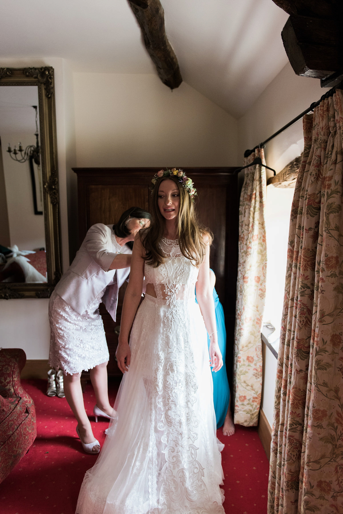 Suzi wears a Yolancris dress and flower crown for her rustic, intimate wedding in the Lake District. Photography by Sarah Folega.