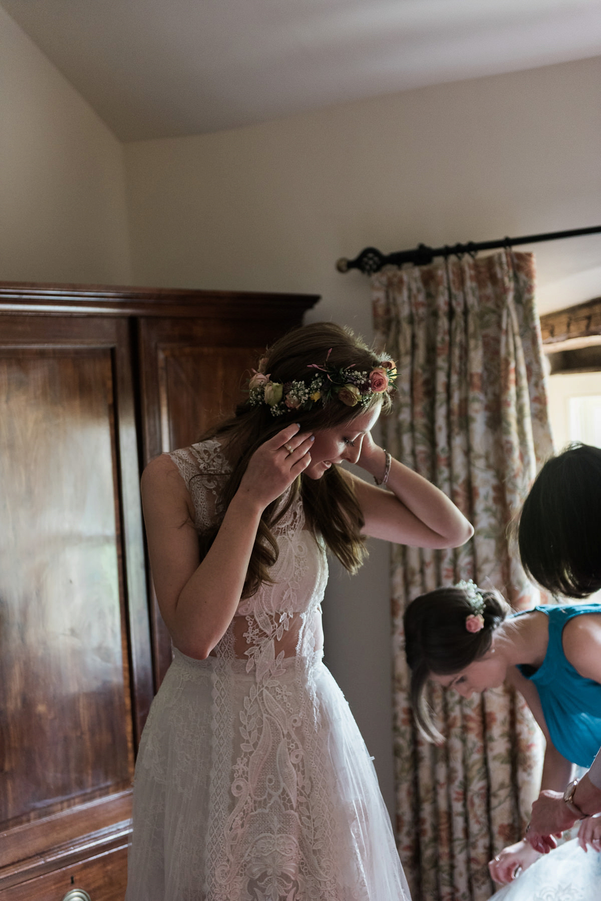 Suzi wears a Yolancris dress and flower crown for her rustic, intimate wedding in the Lake District. Photography by Sarah Folega.