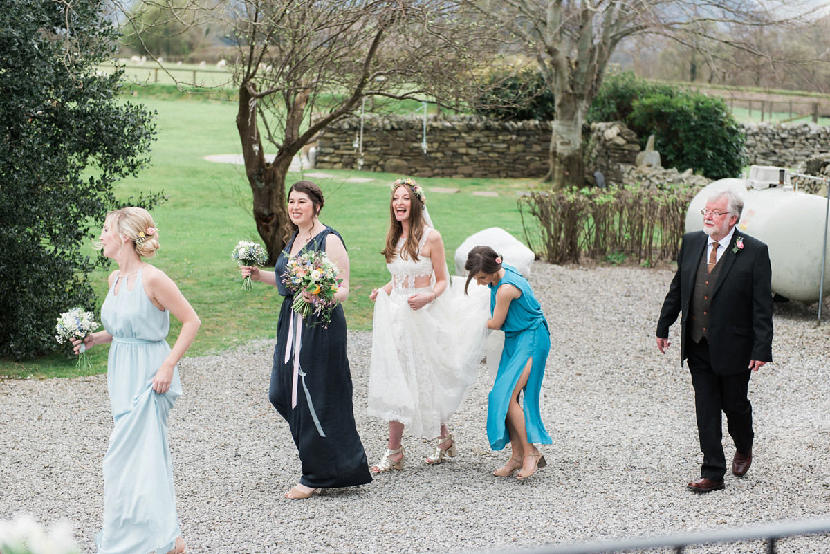 Suzi wears a Yolancris dress and flower crown for her rustic, intimate wedding in the Lake District. Photography by Sarah Folega.