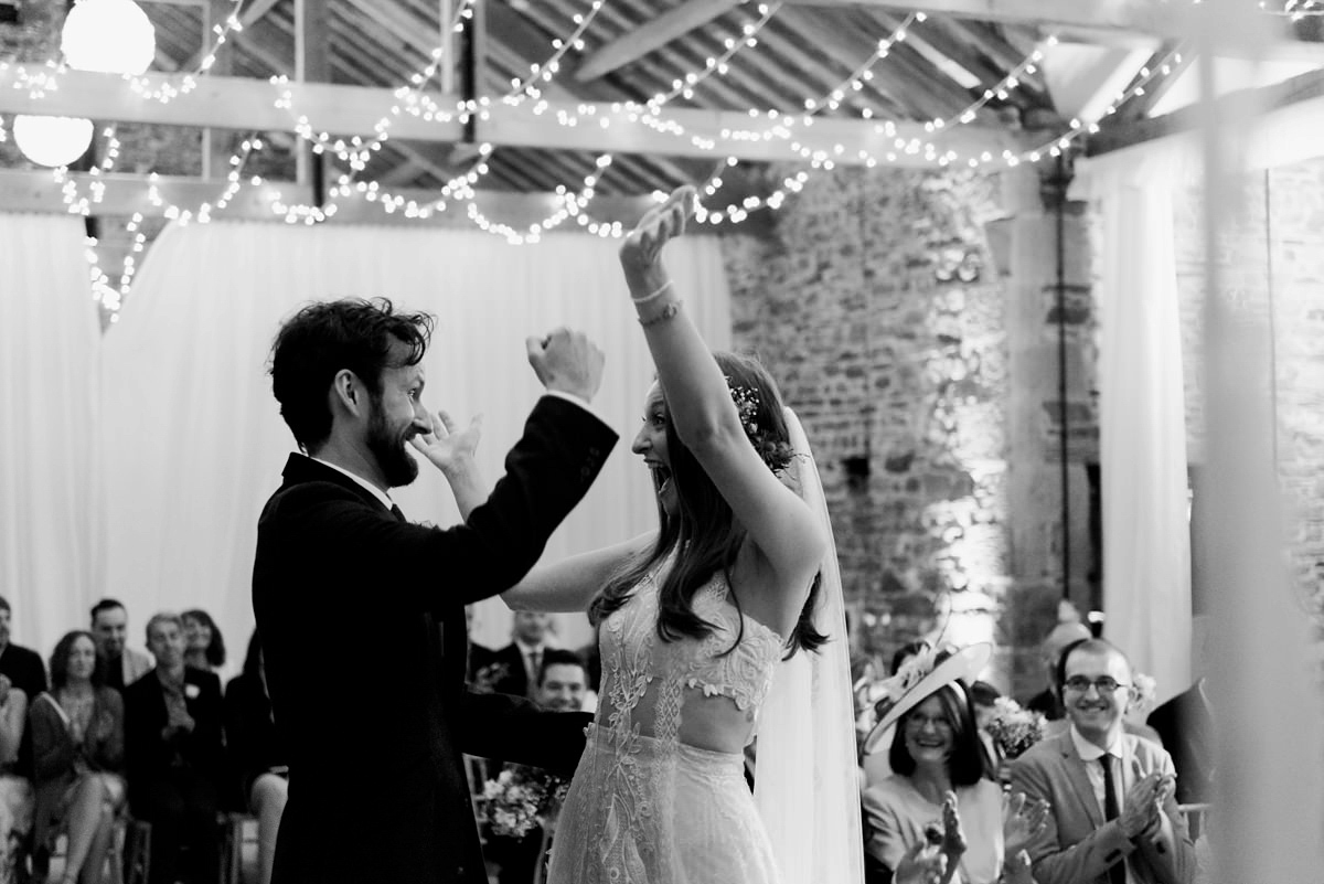 Suzi wears a Yolancris dress and flower crown for her rustic, intimate wedding in the Lake District. Photography by Sarah Folega.