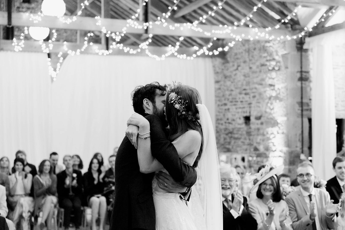 Suzi wears a Yolancris dress and flower crown for her rustic, intimate wedding in the Lake District. Photography by Sarah Folega.