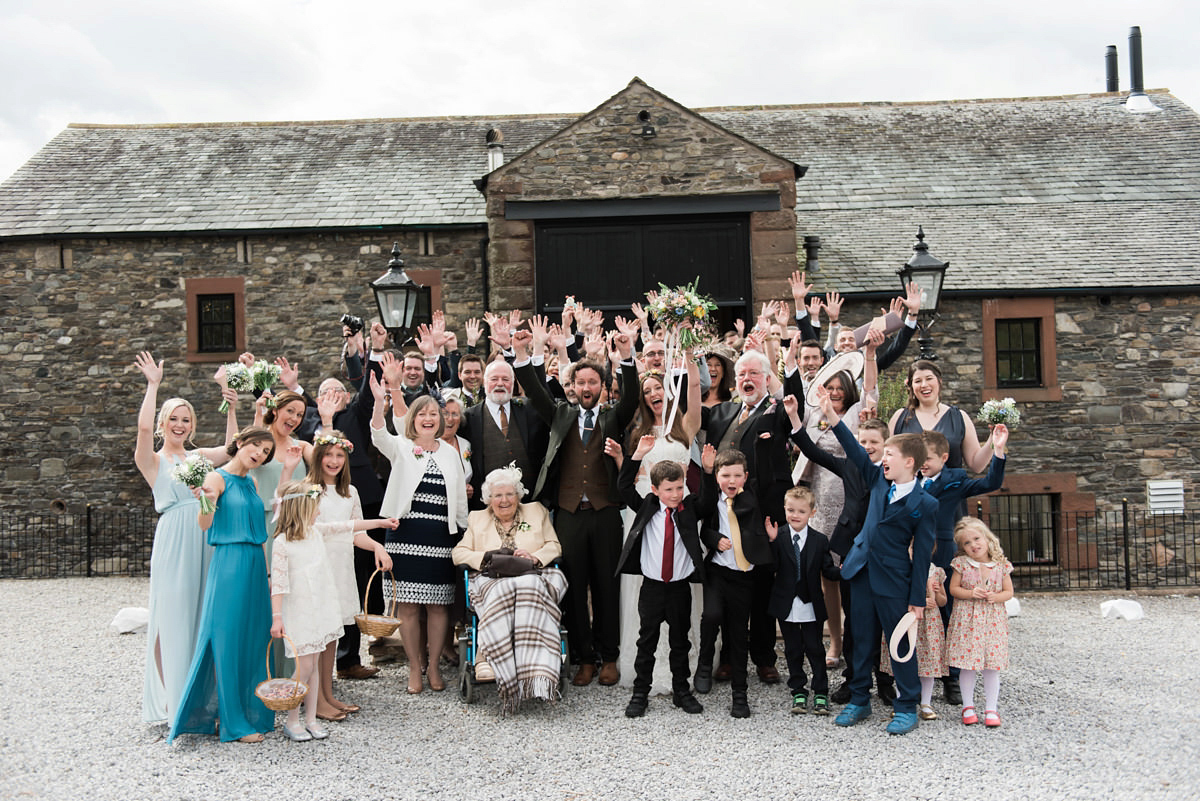 Suzi wears a Yolancris dress and flower crown for her rustic, intimate wedding in the Lake District. Photography by Sarah Folega.