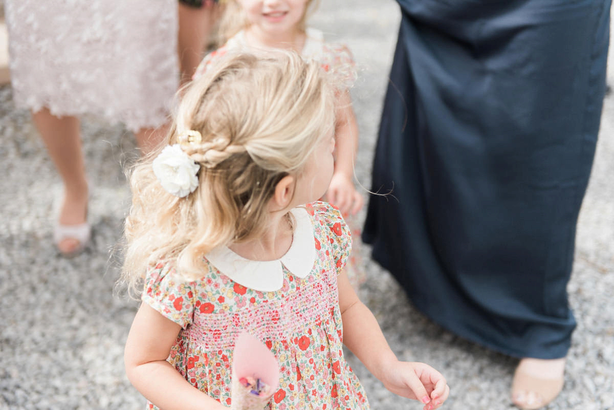 Suzi wears a Yolancris dress and flower crown for her rustic, intimate wedding in the Lake District. Photography by Sarah Folega.