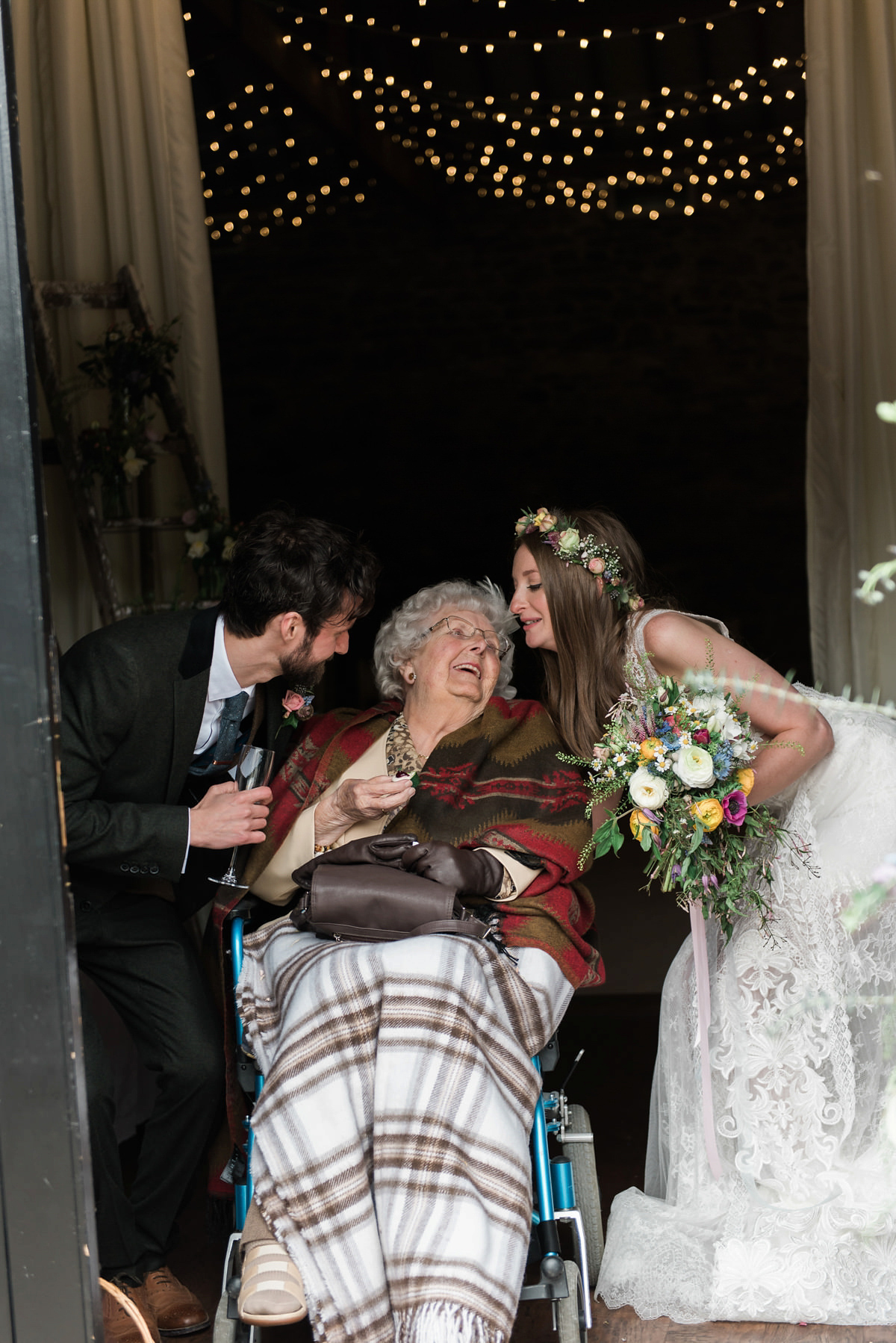 Suzi wears a Yolancris dress and flower crown for her rustic, intimate wedding in the Lake District. Photography by Sarah Folega.