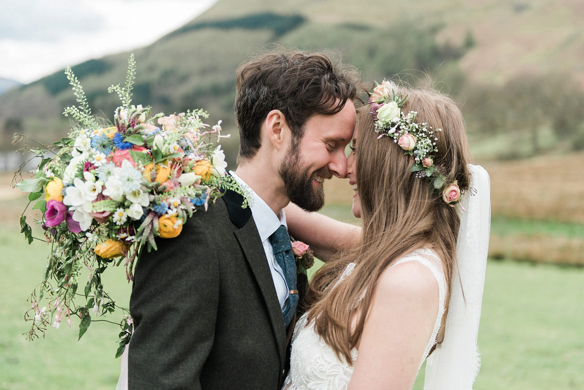 Suzi wears a Yolancris dress and flower crown for her rustic, intimate wedding in the Lake District. Photography by Sarah Folega.