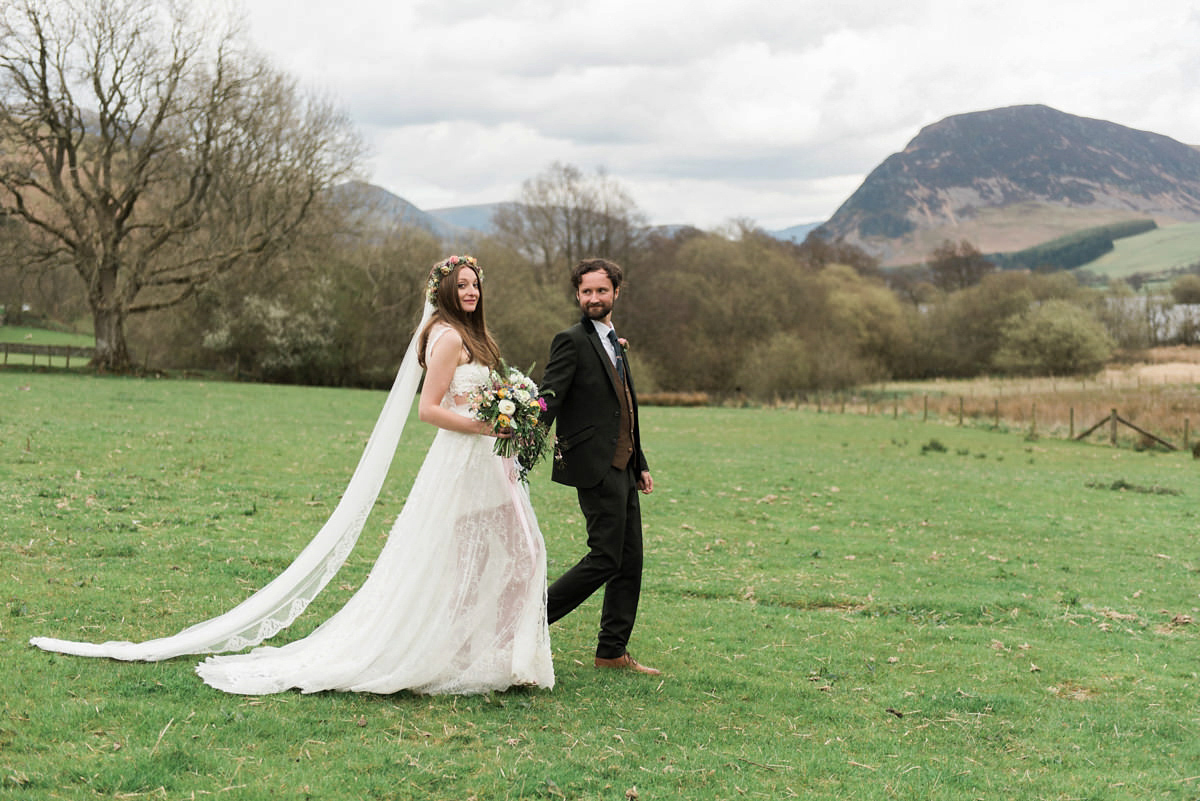 Suzi wears a Yolancris dress and flower crown for her rustic, intimate wedding in the Lake District. Photography by Sarah Folega.