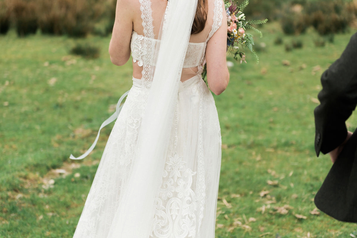 Suzi wears a Yolancris dress and flower crown for her rustic, intimate wedding in the Lake District. Photography by Sarah Folega.