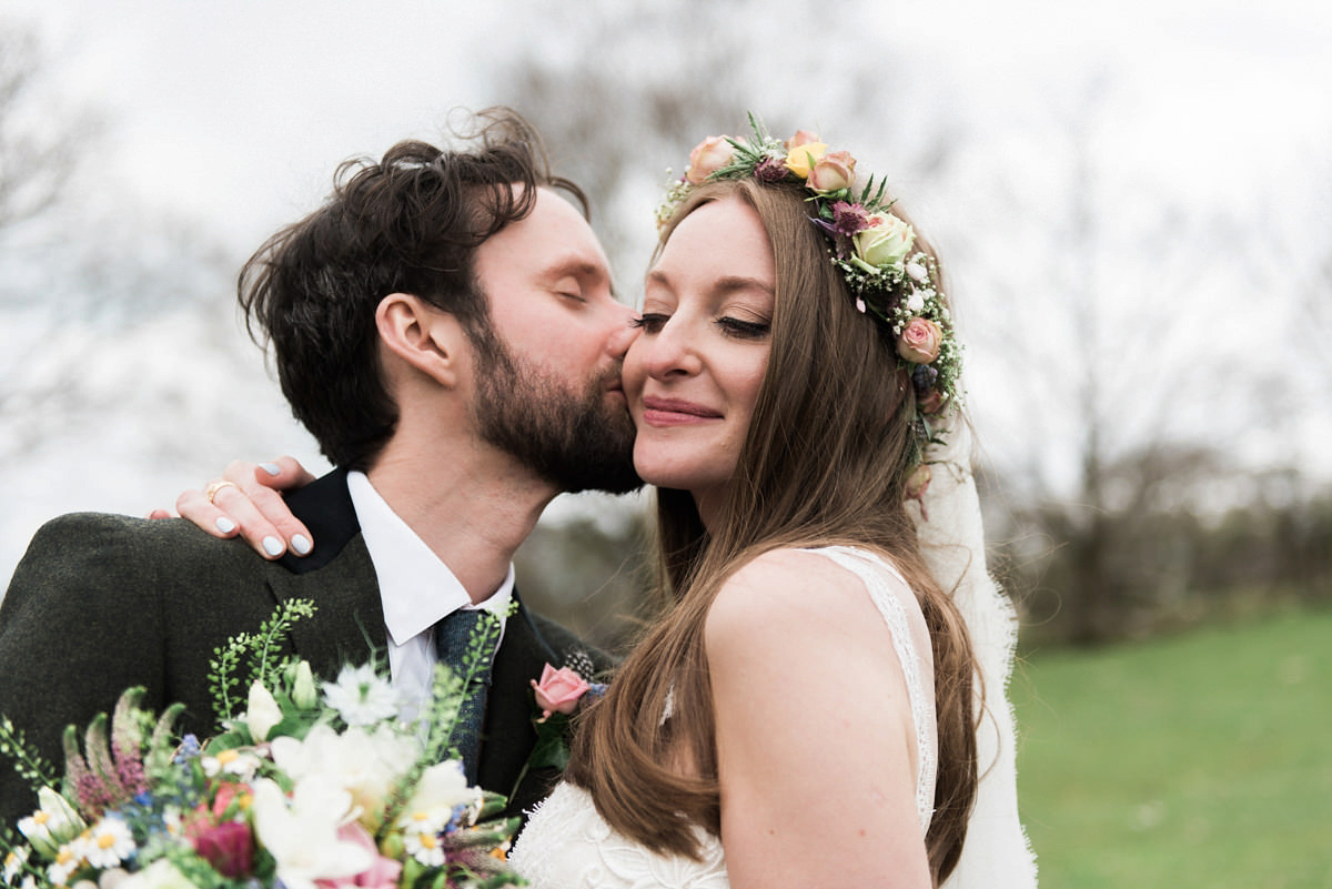 Suzi wears a Yolancris dress and flower crown for her rustic, intimate wedding in the Lake District. Photography by Sarah Folega.