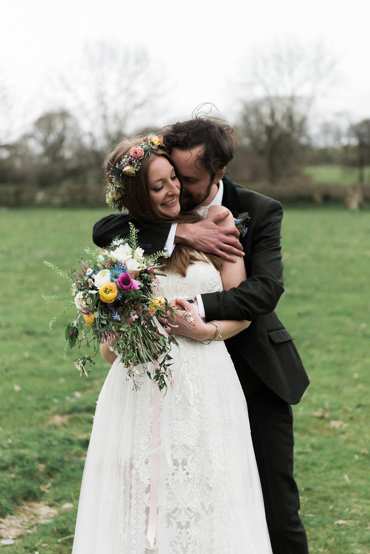 Suzi wears a Yolancris dress and flower crown for her rustic, intimate wedding in the Lake District. Photography by Sarah Folega.