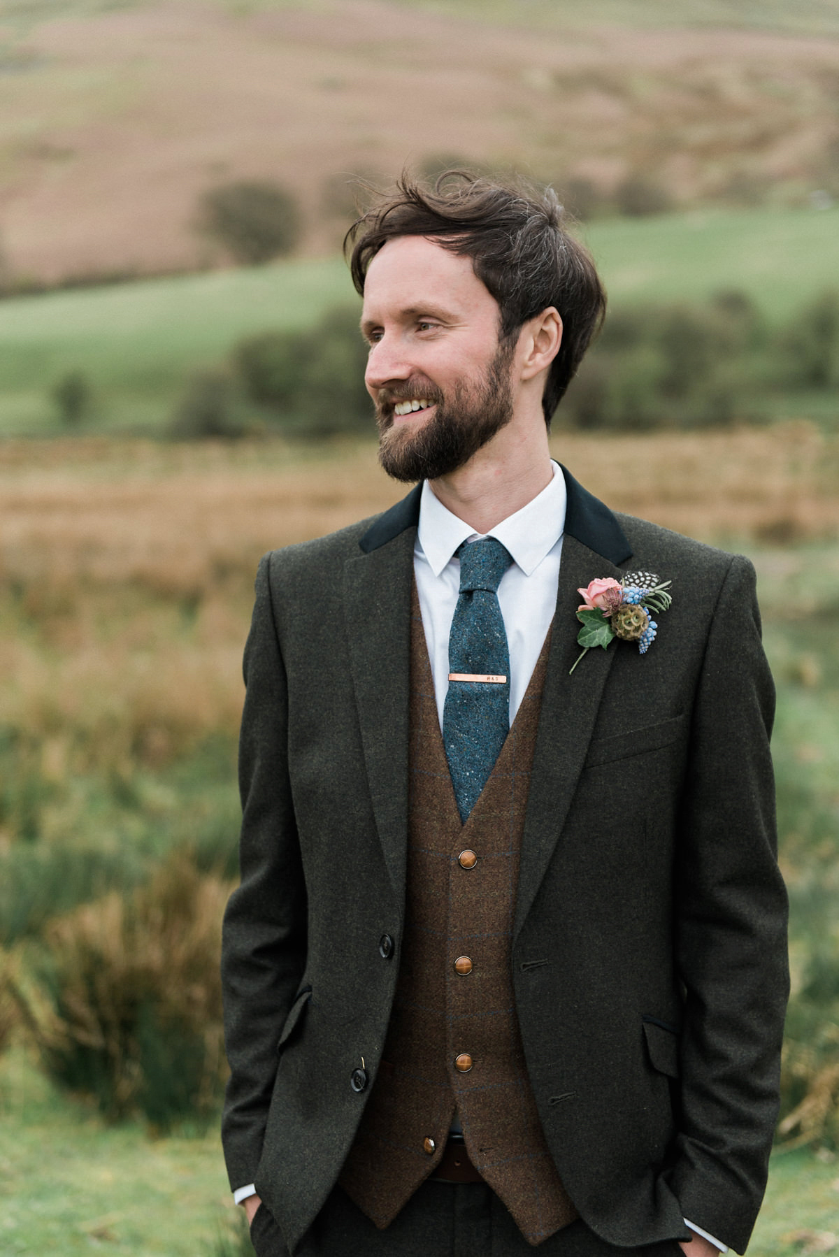 Suzi wears a Yolancris dress and flower crown for her rustic, intimate wedding in the Lake District. Photography by Sarah Folega.