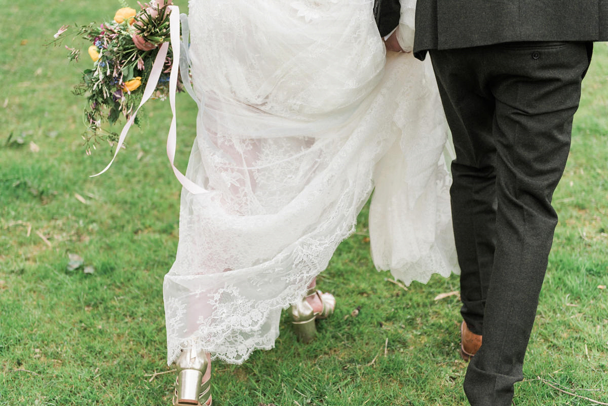 Suzi wears a Yolancris dress and flower crown for her rustic, intimate wedding in the Lake District. Photography by Sarah Folega.