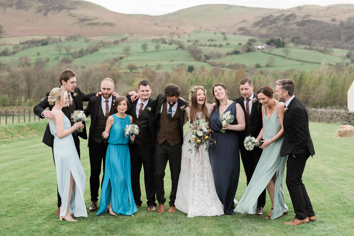 Suzi wears a Yolancris dress and flower crown for her rustic, intimate wedding in the Lake District. Photography by Sarah Folega.