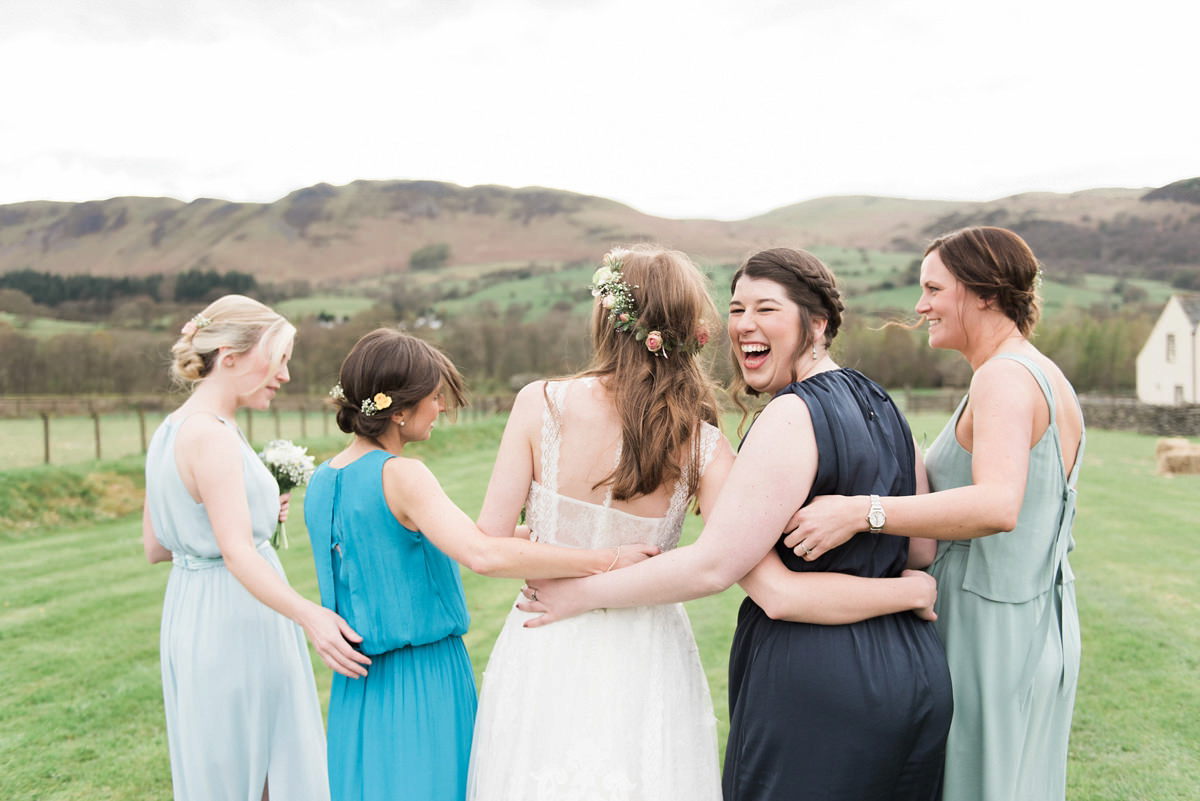 Suzi wears a Yolancris dress and flower crown for her rustic, intimate wedding in the Lake District. Photography by Sarah Folega.