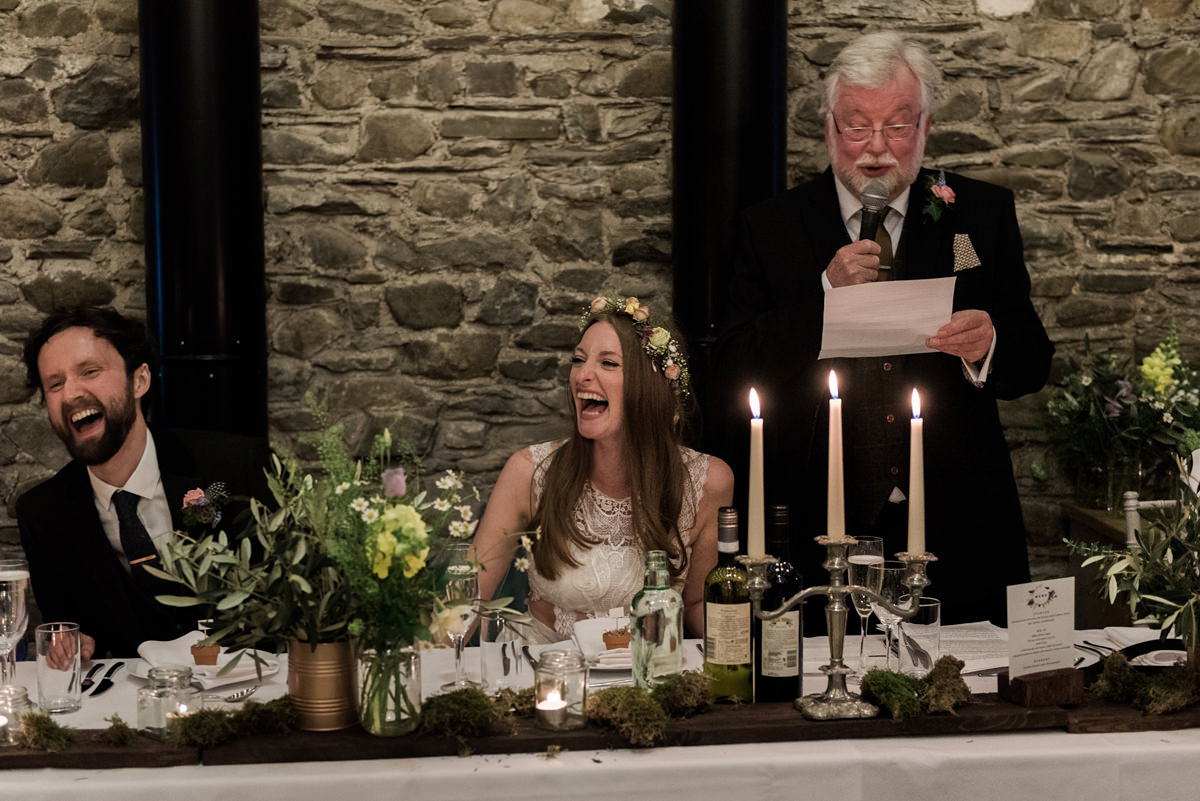 Suzi wears a Yolancris dress and flower crown for her rustic, intimate wedding in the Lake District. Photography by Sarah Folega.