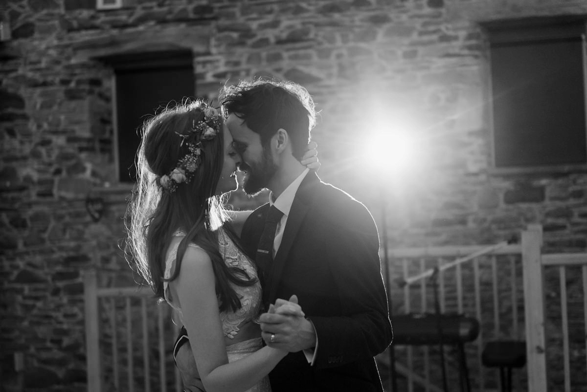 Suzi wears a Yolancris dress and flower crown for her rustic, intimate wedding in the Lake District. Photography by Sarah Folega.