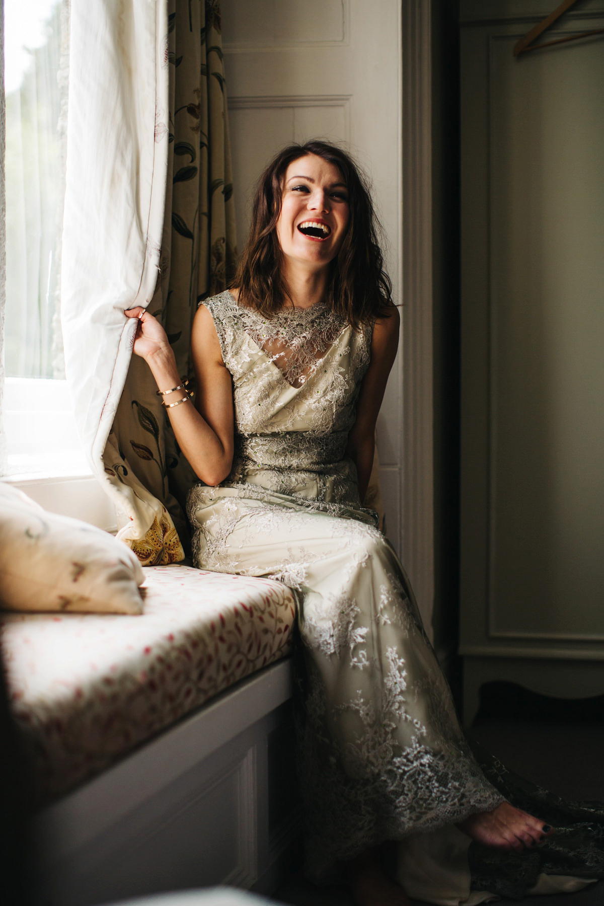 Boho bride Alice wore a pale green lace wedding dress and floral crown for her wild woodland inspired, free spirited South Devon wedding at Langdon Court. Photography by Richard Skins.