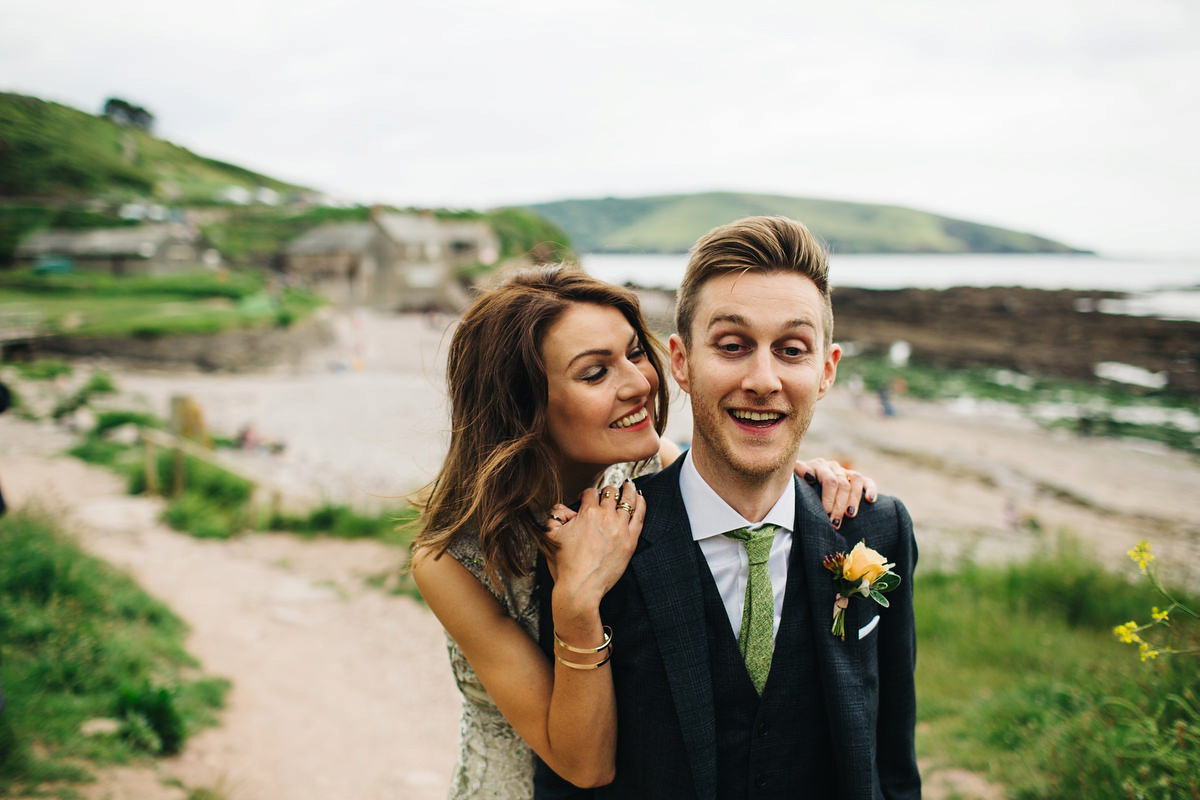 Boho bride Alice wore a pale green lace wedding dress and floral crown for her wild woodland inspired, free spirited South Devon wedding at Langdon Court. Photography by Richard Skins.