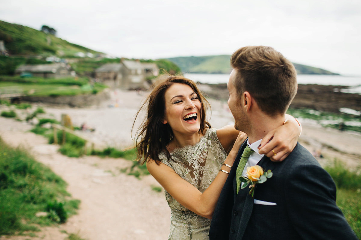 Boho bride Alice wore a pale green lace wedding dress and floral crown for her wild woodland inspired, free spirited South Devon wedding at Langdon Court. Photography by Richard Skins.